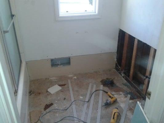 Bathroom drywall water damage and repair.