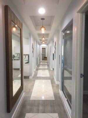 Really pretty hallway. If you're afraid of doctors, waking down this is calming and modern. Lighting is great!