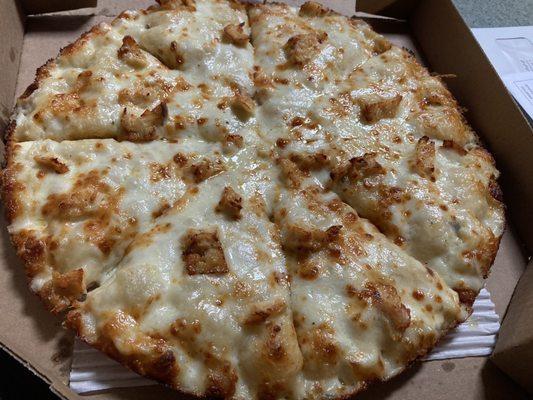 Pan pizza with Alfredo sauce and chicken.