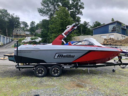 A Malibu 23 LSV with our new showroom in the background