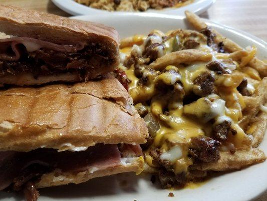 Pork shoulder sandwich with steak and cheese fries,  delicious!