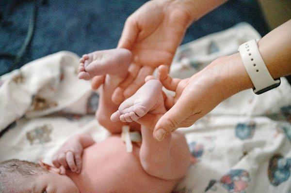 Checking baby's reflexes during a newborn exam!