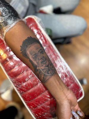 She's wearing her heart on her sleeve. Portrait of her son Done by FrenchysTattoos female tattoo artist