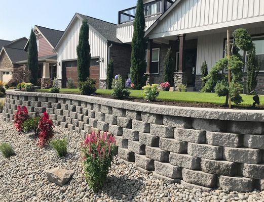 Western Paver design complete front yard project. Wall, Turf, lighting and landscape.