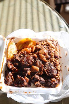 Oxtails with rice & beans and a side of plantains.