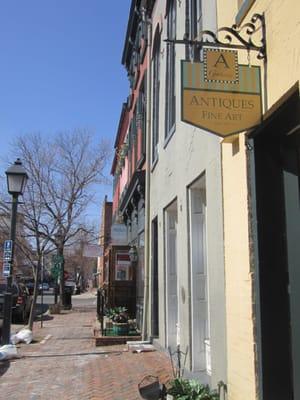 old town cobble stone sidewalk and store entrance