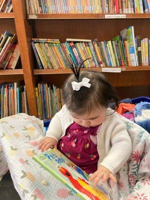 Baby looking at Elmo book