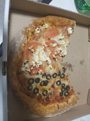 Small pizza. 6 slices but enough for 2 ppl.  Half black olives half feta and tomato