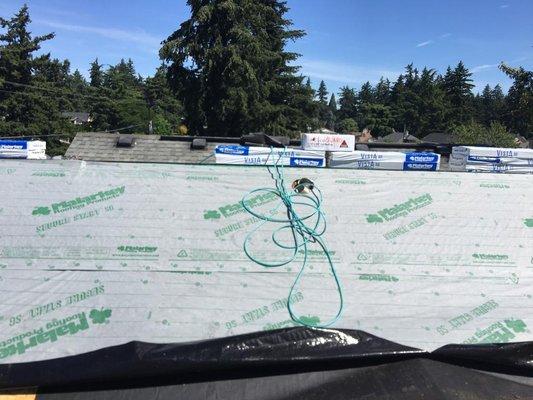 Underlayment (paper) in process of being laid down.  (Photos courtesy Portland Quality Roofing)