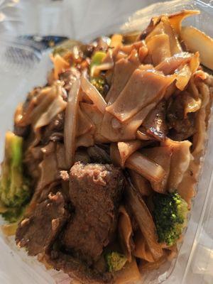 The beef chow fun with broccoli and onions.