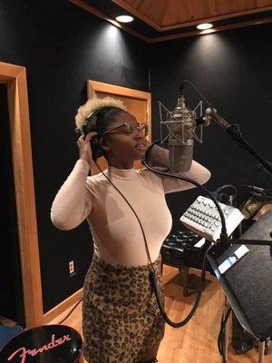 Imani cutting vocals in Cue's Studio A