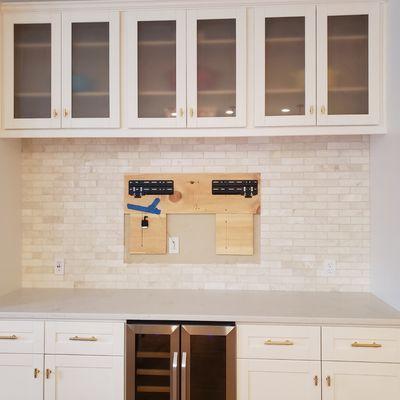 Quartz countertops and Marble backsplash