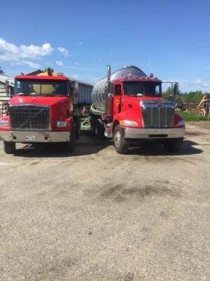 Our Bright Red, Yellow and Chrome Trucks! Getting ready for the day to provide septic tank pumping services to the Sebago Lak...