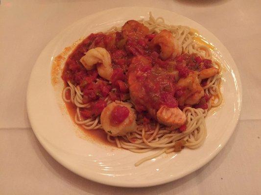 Arturo - combination of jumbo shrimp, sea scallops & salmon in linguine made with red pepper sauce