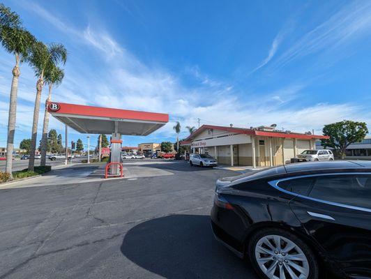 Gas station, with the Tesla getting gas