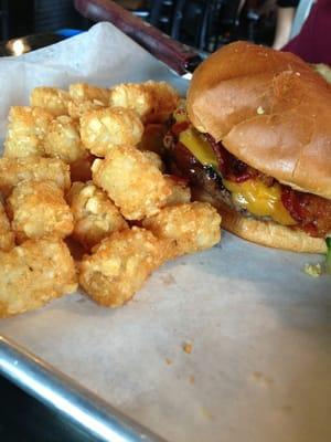 BBQ, bacon cheese burger topped with onion rings w/tots on the side