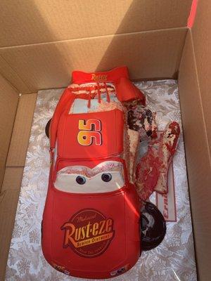 This is our red velvet lightning McQueen cake  more like pink cake