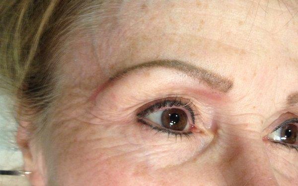 Healed eyebrows, top & bottom eyeliner