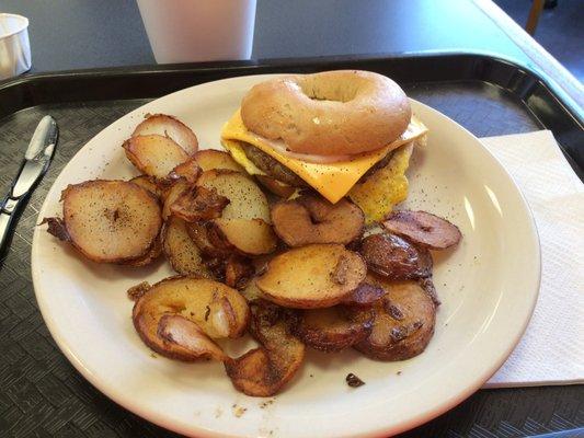 Another awesome breakfast at the Carousel Cafe!   Sausage, egg & cheese on a toasted bagel with home fries