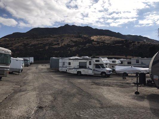 Nice mountain across the street, uneven gravelly dirt lot.