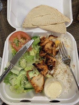 Chicken kabob with rice and salad