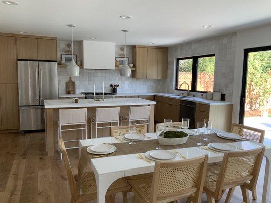 4x4 tile backsplash and honed porcelain countertops.