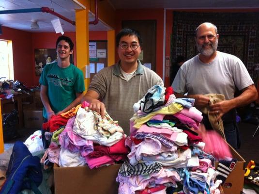 sorting donated clothing for needy families