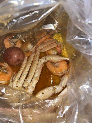 Snow crab and headless shrimp boil with seasoned garlic butter sauce