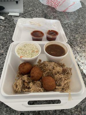 Pulled pork, hush puppies, Cole slaw, baked beans.