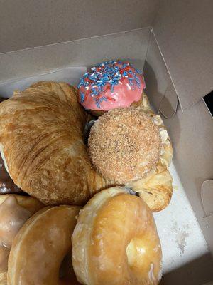 Fresh croissant and fun pink doughnut!