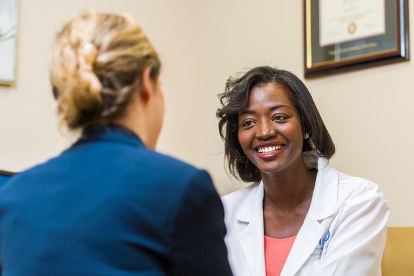 Dr. Gueye and a patient consultation.