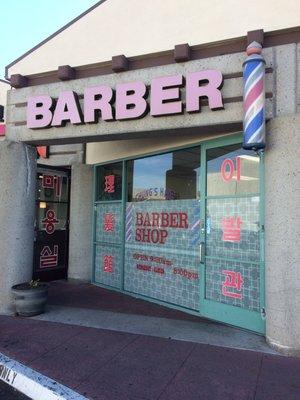 Right next to another barber shop that looks slightly more expensive