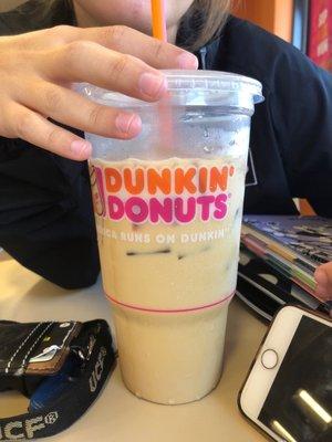 Large caramel iced coffee with cream and sugar