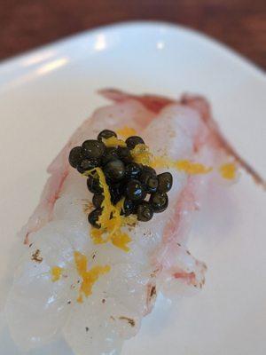 Fresh shrimp with caviar and orange zest