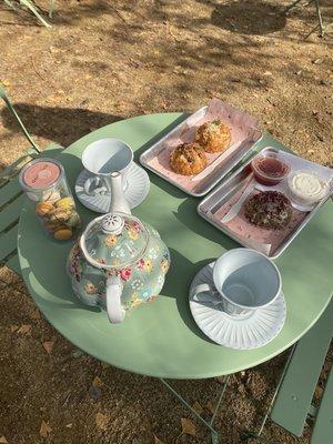 Starting tea pot service for all to enjoy scones with cream and jam outside at our courtyard area