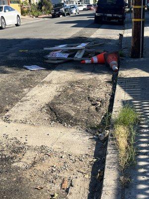 Junk and a messed up street left by Andes Construction