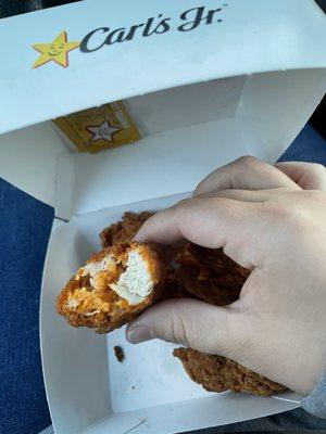 Chicken strips I received with something orange inside.