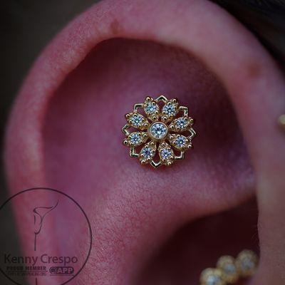 Gold jewelry for body piercings. Schedule your visit at newflowerstudio.com.