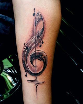 Music note on left forearm by Southbay Mike at Blackwater Tattoo