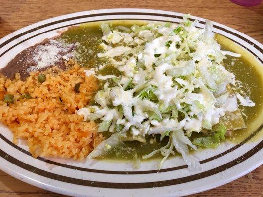 Chicken Enchiladas Verde with yellow rice and refined beans