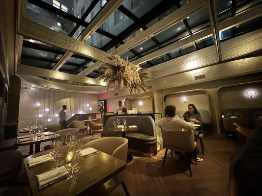 Second floor dining with a huge skylight.