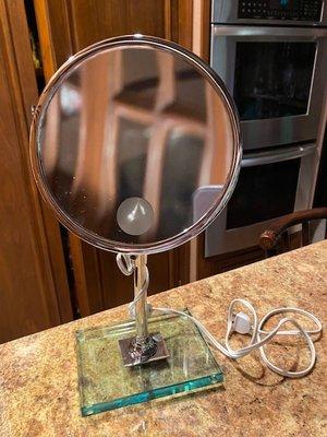 Beautifully repaired mirror on new glass base.