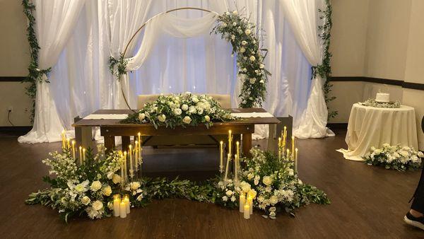 Design wedding ceremony. Bridal table . Flowers, arch. Flame less Crystals candles .