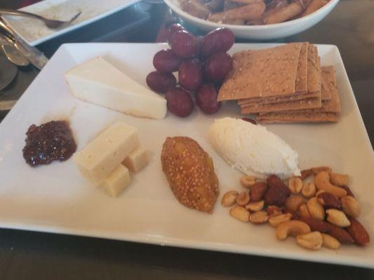 Cheese board. A soft, medium and hard cheese. Goat cheese with lemon curd was yum-O. Fig jam and pineapple mustard seed jam.