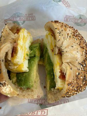 Two eggs, bacon, avocado on a skinny Everything bagel.