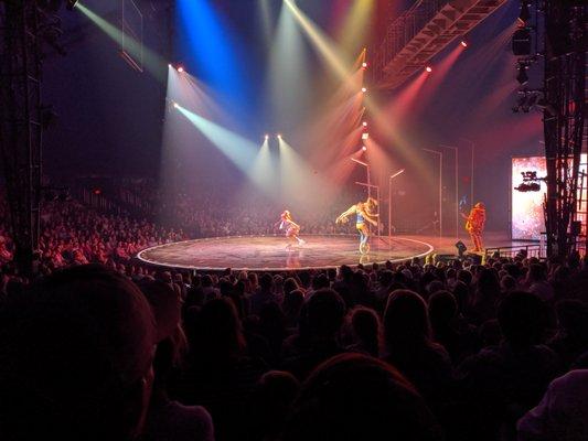 Choreographed hand-to-hand duo on unicycle with a roller-skater.