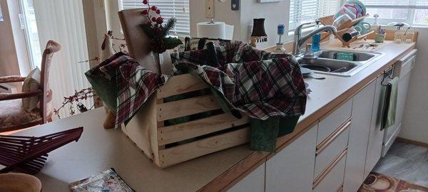 Crates are great to use especially for a man. Lined with material and stuffed between the slats holds it still and gives it a cute look.