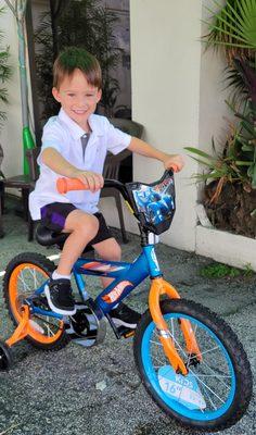 Love that million dollar smile! 1 of 102 bikes being awarded to a local elementary school.