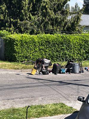 I watched as bills towing through garbage out if his truck next to 2 homeless men who have set up an encampment across from my house.