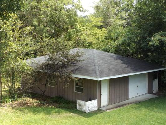 Tree limbs in contact with the roof can damage the roof cover